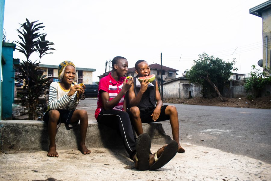Teenagers eating fruit together